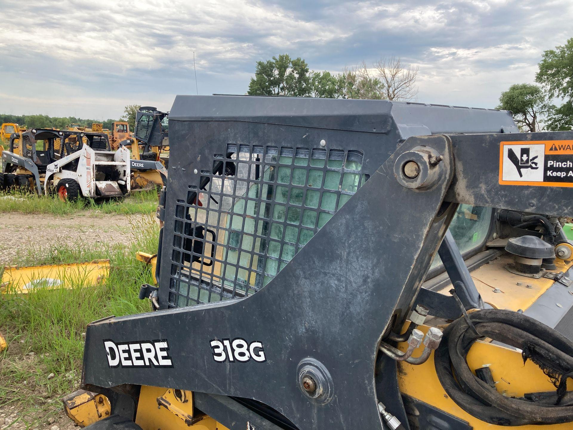 AT494673 | John Deere 318G Cab Assembly for Sale