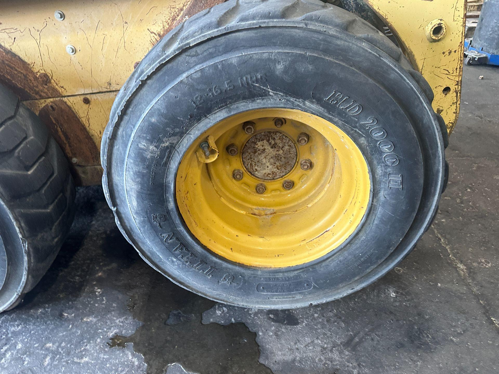 CAT 216 Tire and Rim for Sale