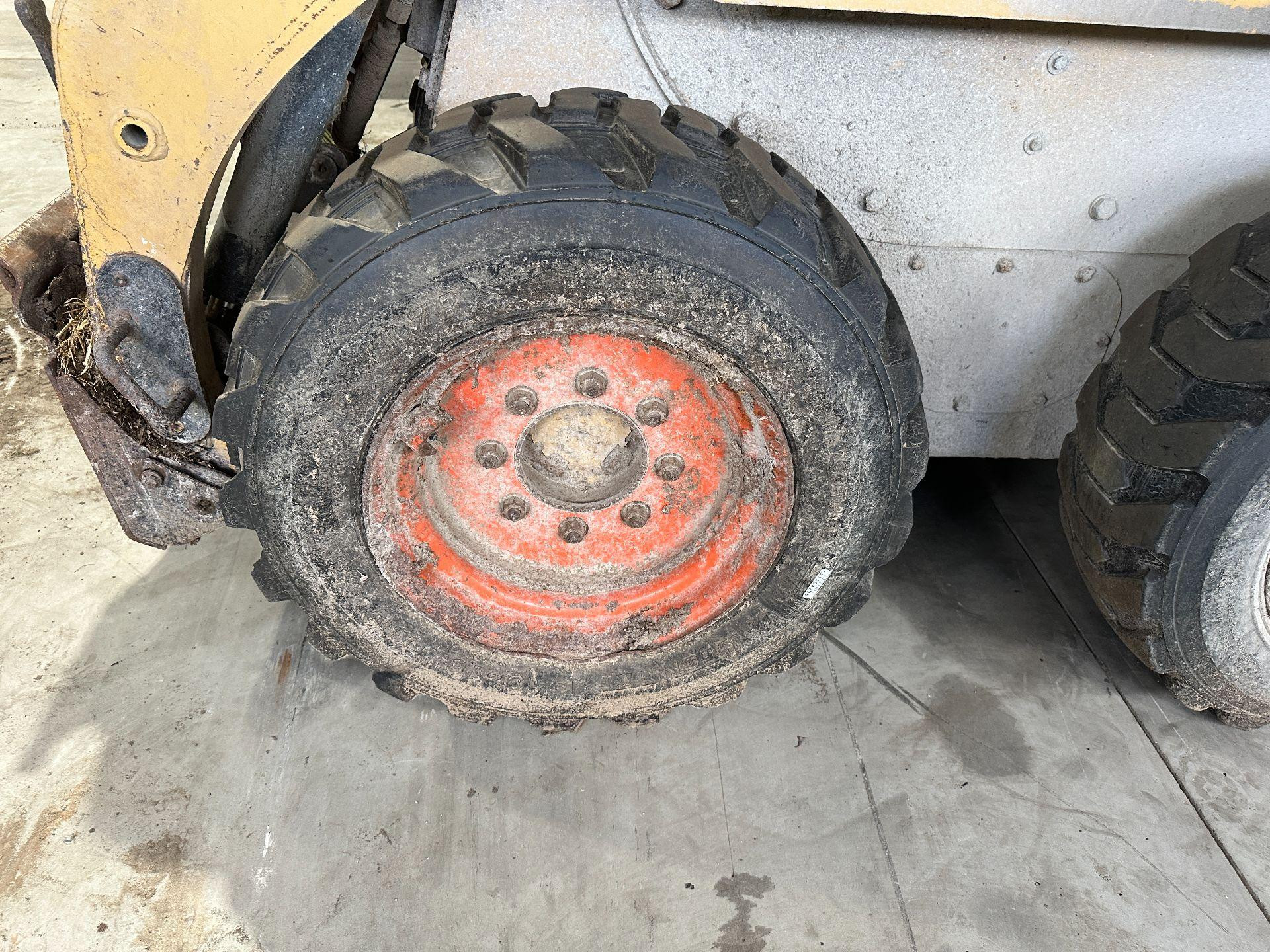 CAT 216 Tire and Rim for Sale