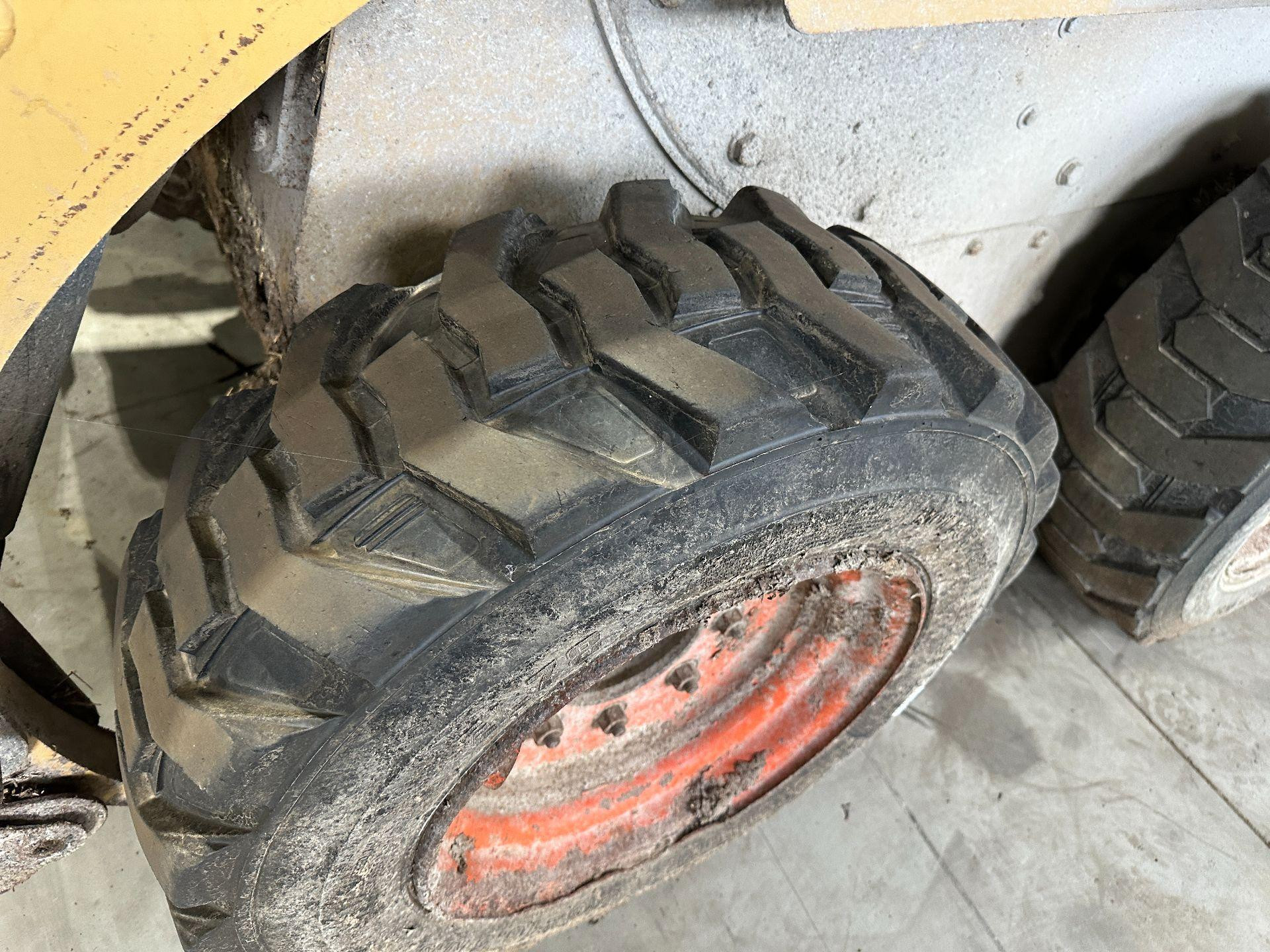CAT 216 Tire and Rim for Sale