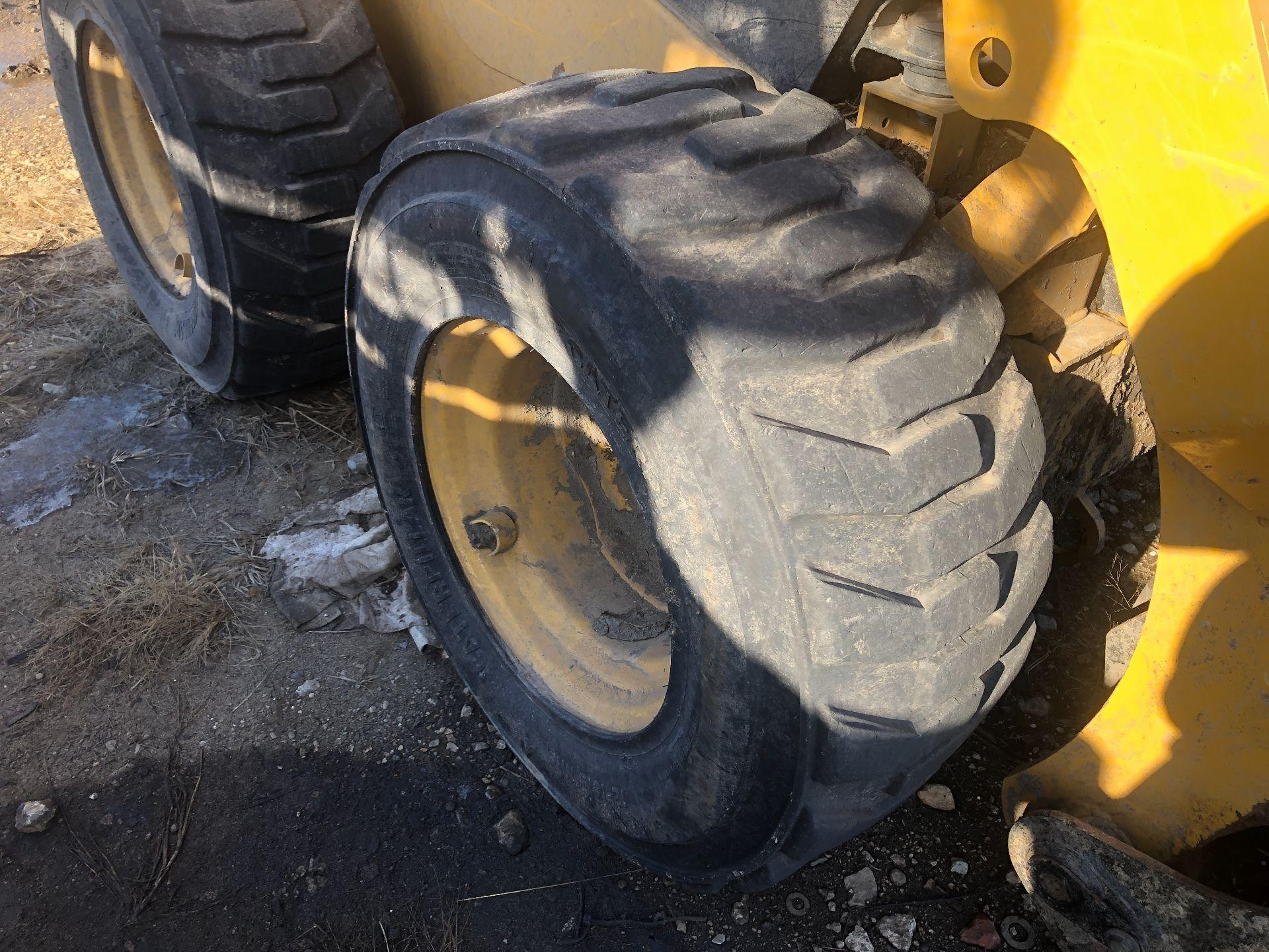 556-5845 | CAT 242D3 Tire and Rim for Sale