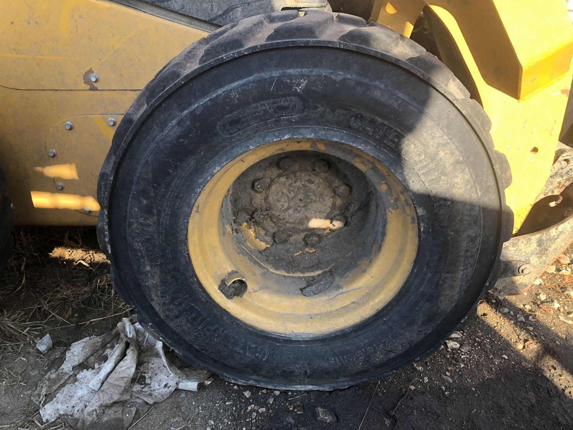 556-5845 | CAT 242D3 Tire and Rim for Sale