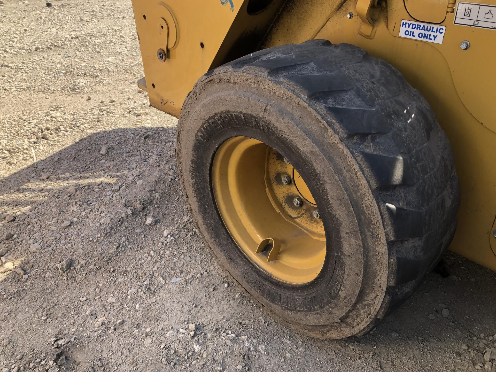 142-8731 | CAT 242D3 Tire and Rim for Sale