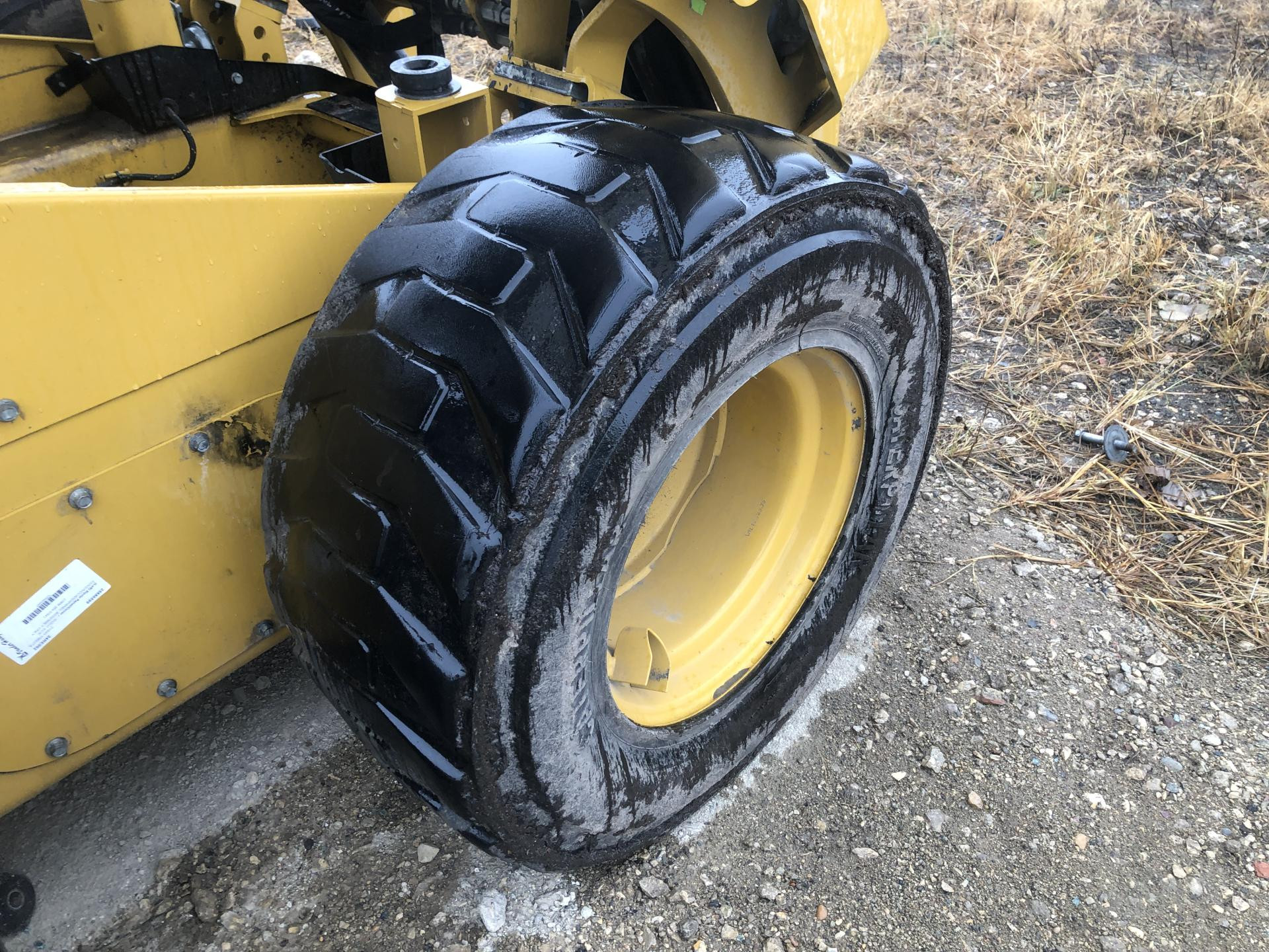 CAT 242D3 Tire and Rim for Sale