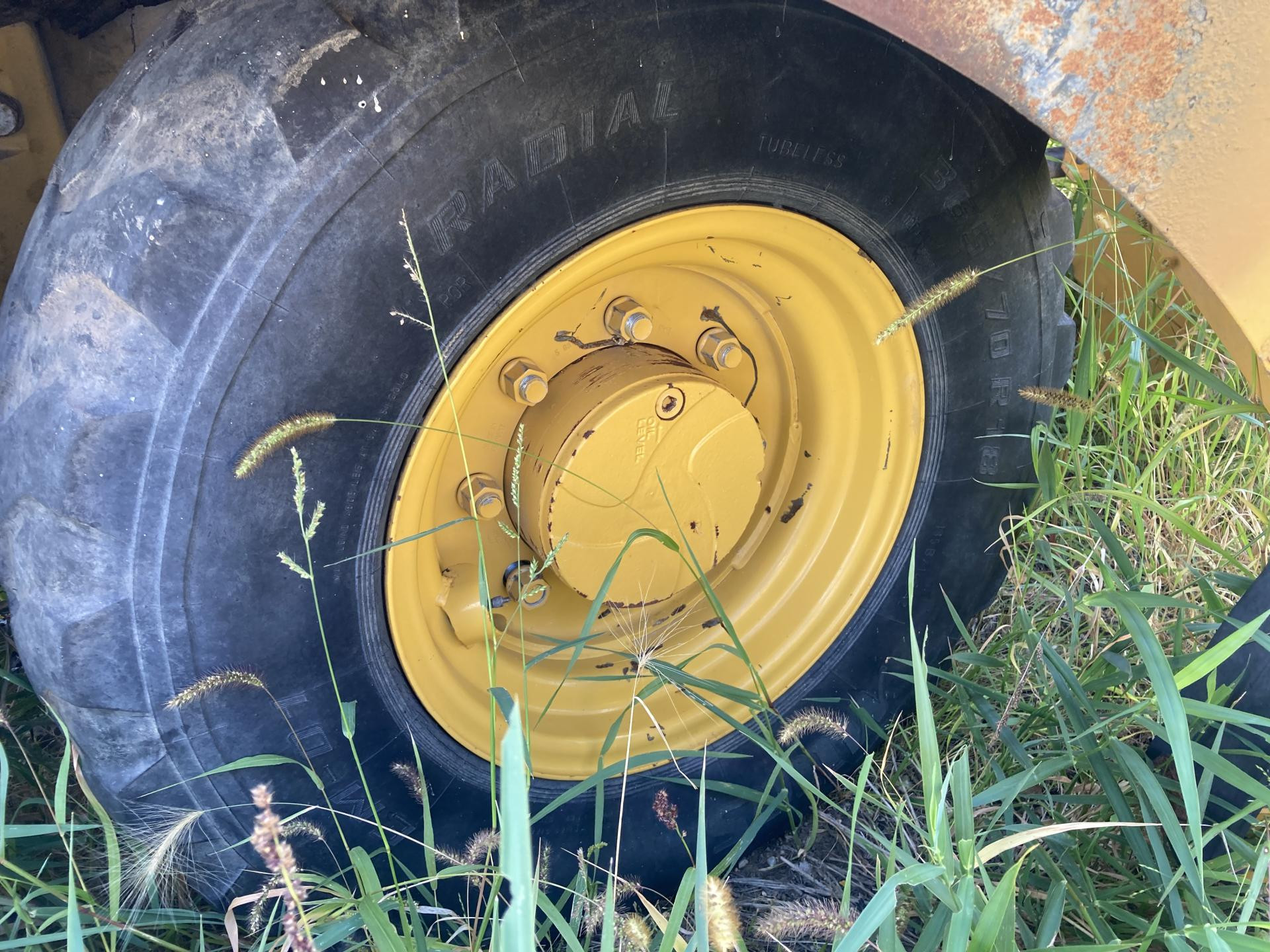 John Deere 324J Tire and Rim for Sale