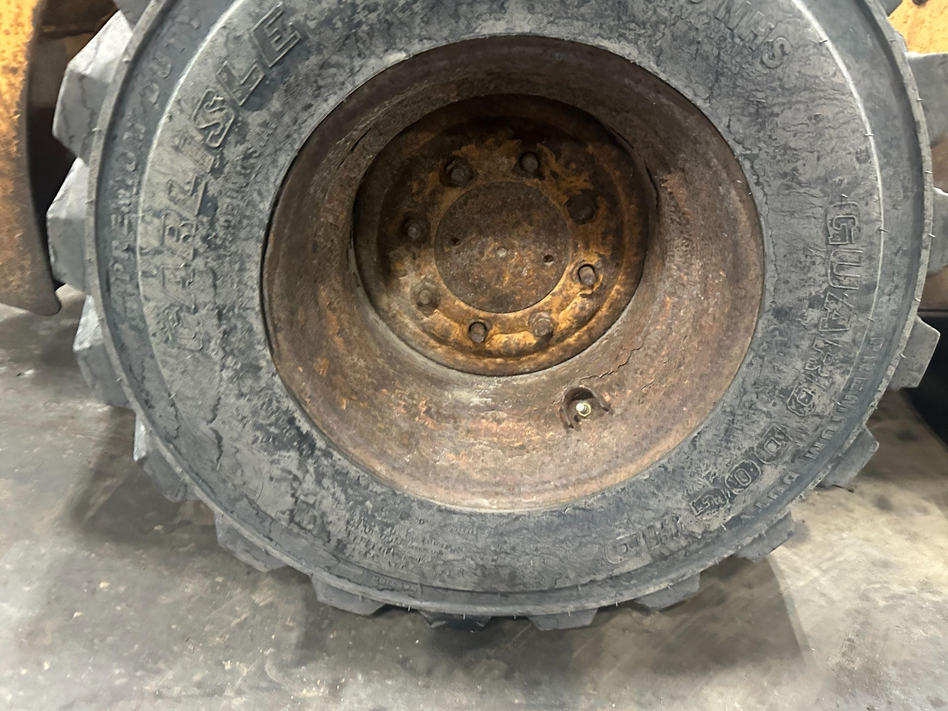 Case 60XT Tire and Rim for Sale