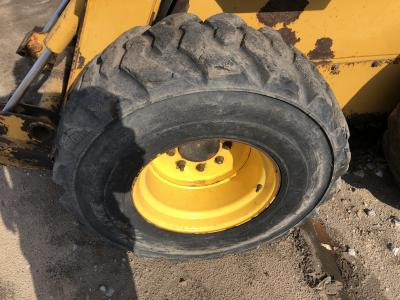 John Deere 324J Tire and Rim for Sale