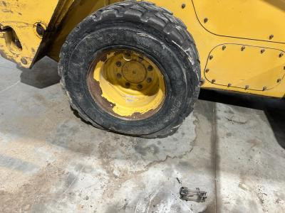 CAT 272C Right/Passenger Tire and Rim - Used