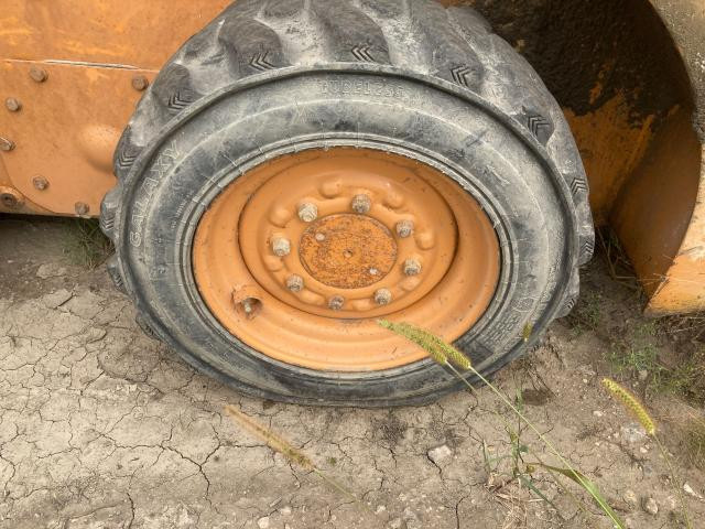 2002 Case 40XT Left Tire And Rim: P/N 408450A1